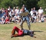 Knights in armour battle with swords